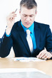 Businessman exploring numbers carefully