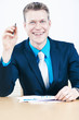 Businessman smiling after sales report