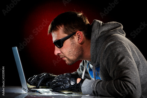 Photo: Hacker with laptop Hacker with laptop