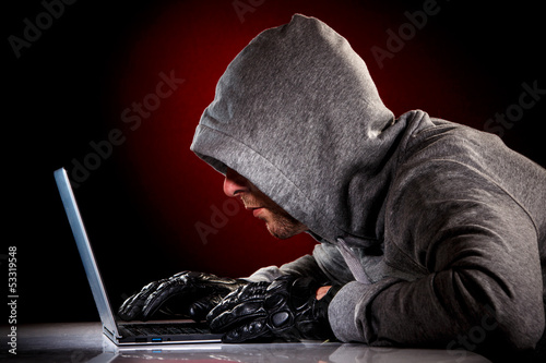 Photo: Hacker with laptop Hacker with laptop