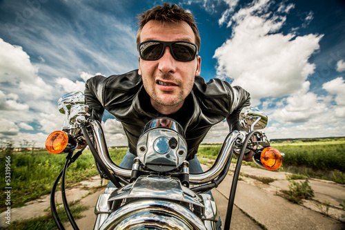 Photo: Biker racing on the road Biker racing on the road