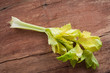 Celery twig on wooden table