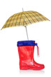 Rain boot and a yellow umbrella