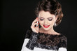 Young happy woman talking on mobile phone. Fashion Brunette Mode