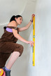 Woman finding a straight line spirit level