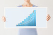 Photo: woman holding board with 3d graph woman holding board with 3d graph
