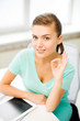 girl with tablet pc showing ok gesture