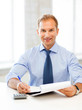 Photo: businessman with notebook and calculator businessman with notebook and calculator