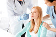 male plastic surgeon with patient