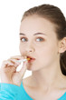 Young woman smoking electronic cigarette (ecigarette)