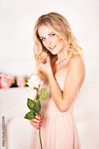 Photo: portrait of a beautiful girl with a bouquet of roses portrait of a beautiful girl with a bouquet of roses