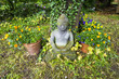 Photo: buddha statue in sitting position under a cherry tree buddha statue in sitting position under a cherry tree