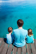 Photo: Father and kids enjoying ocean view Father and kids enjoying ocean view