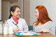 doctor and patient at table
