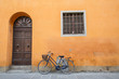 Blue Bike on Orange Wall
