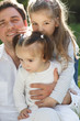 Photo: Happy young father with two little daughters Happy young father with two little daughters