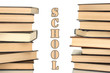 Two towers of books on white background close-up