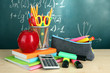 Back to school - blackboard with pencil-box and school