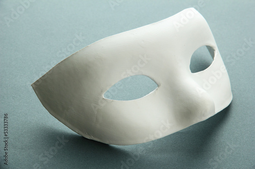 Photo: White mask, on grey background White mask, on grey background
