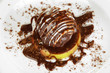 Chocolate dessert on big plate close up