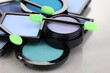 Bright eye shadows and sponge brushes for foundation