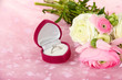 Ranunculus (persian buttercups) and engagement ring,