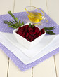 Sliced beetroot on bowl on wooden table close-up