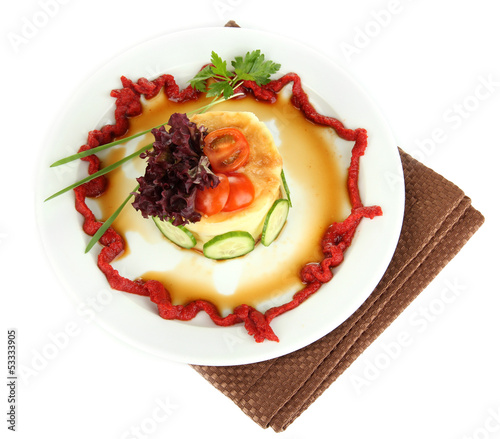 Photo: Small portion of food on big plate isolated on white Small portion of food on big plate isolated on white