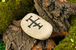 Fortune telling  with symbols on stone close up