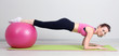 Photo: Portrait of beautiful young woman exercises with gym ball Portrait of beautiful young woman exercises with gym ball