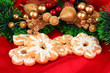 Photo: Christmas cookies and decorations on color fabric background Christmas cookies and decorations on color fabric background
