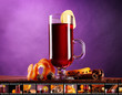 Mulled wine in glass with photographic film of drinks