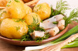 Foto: Herring marinaded with potato and fennel on a white plate Herring marinaded with potato and fennel on a white plate