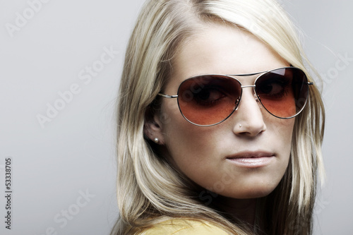 Photo: Beautiful Caucasian female model in sunglasses Beautiful Caucasian female model in sunglasses