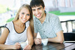Beautiful young couple at cafe