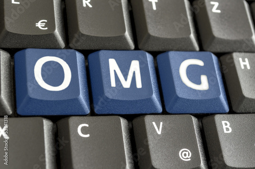 Photo: Abbreviation OMG written on computer keyboard Abbreviation OMG written on computer keyboard