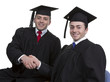 Male Graduates Shaking Hand