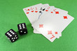 Playing cards, dice on cloth