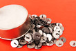 thumbtacks in a metal box.