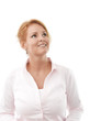 Close-up of a young woman looking up against white background
