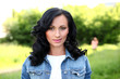 Beautiful brunette woman in casual at the park