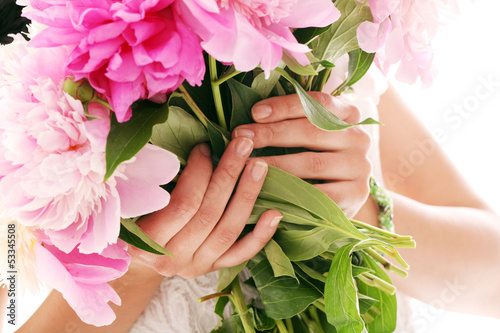 Photo: Bouquet of peonies in woman's hands Bouquet of peonies in woman's hands