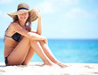 Summer vacation woman  on beach with beach hat