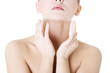 Photo: Beautiful sensual young woman touching her neck Beautiful sensual young woman touching her neck