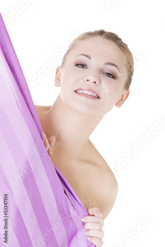 Photo: Beautiful woman covering her body with shower curtain Beautiful woman covering her body with shower curtain