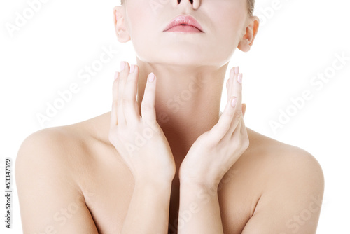 Photo: Beautiful sensual young woman touching her neck Beautiful sensual young woman touching her neck