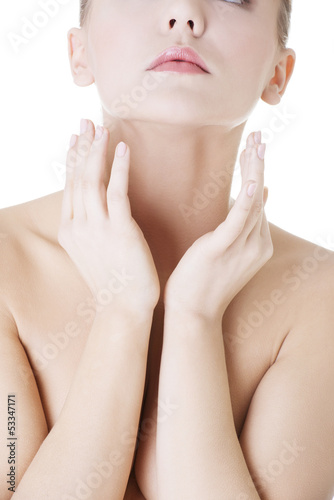 Photo: Beautiful sensual young woman touching her neck Beautiful sensual young woman touching her neck