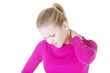 oung woman holding hand on her neck.