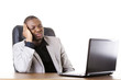 Stressed businessman working on laptop