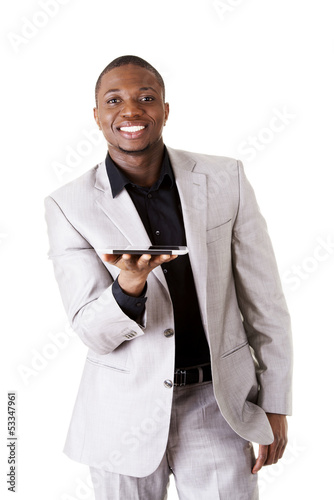 Photo: Handsome businessman working on tablet computer. Handsome businessman working on tablet computer.